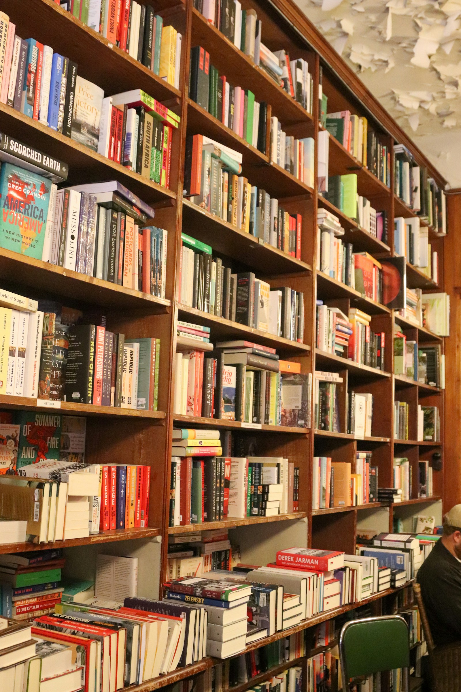 Books arranged on shelves in an independent bookstore